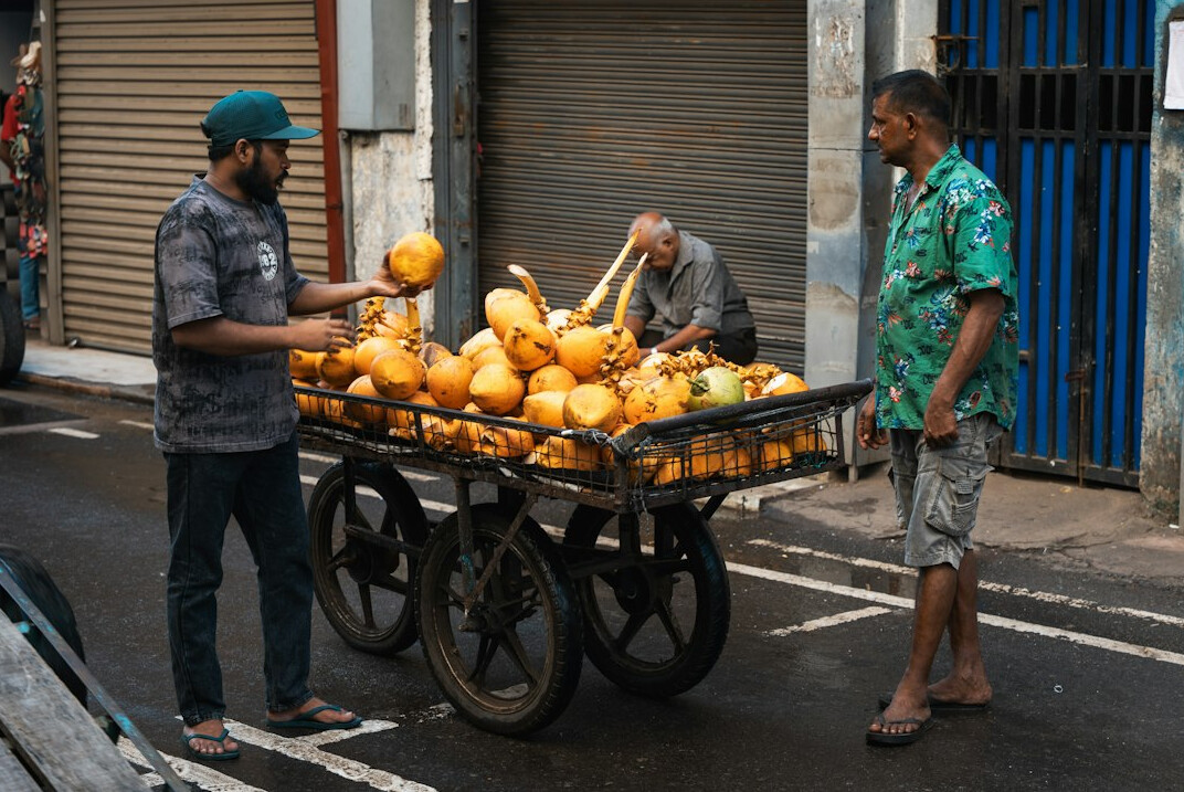 Vendor selling fresh produce at an outdoor street market